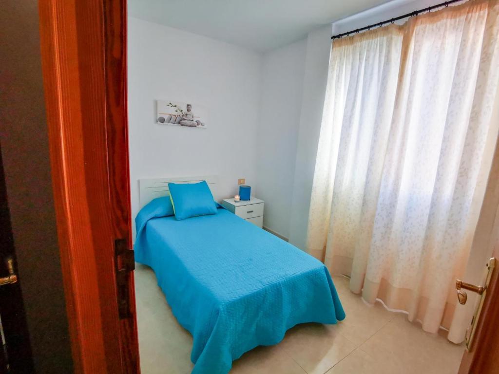 Postel nebo postele na pokoji v ubytování Puesta de Sol Rentals 2DR