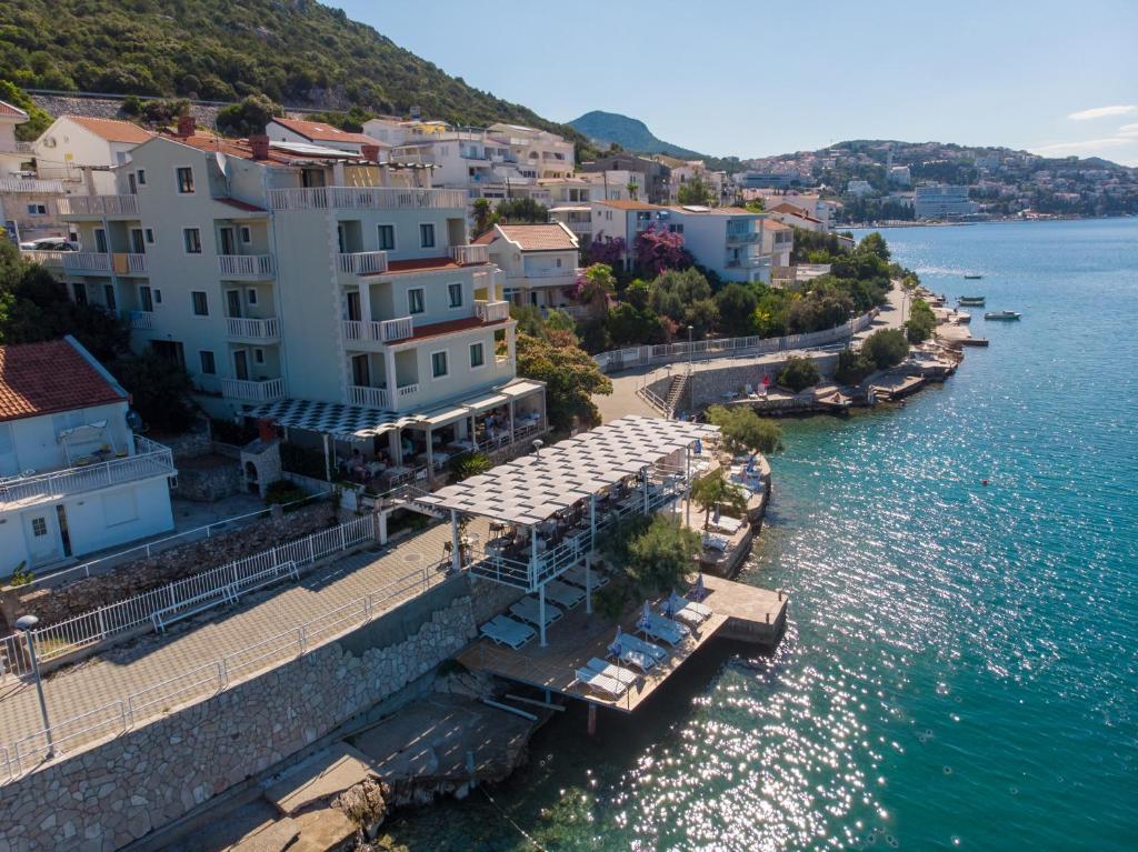 an aerial view of a town next to the water at Hotel Posejdon in Neum