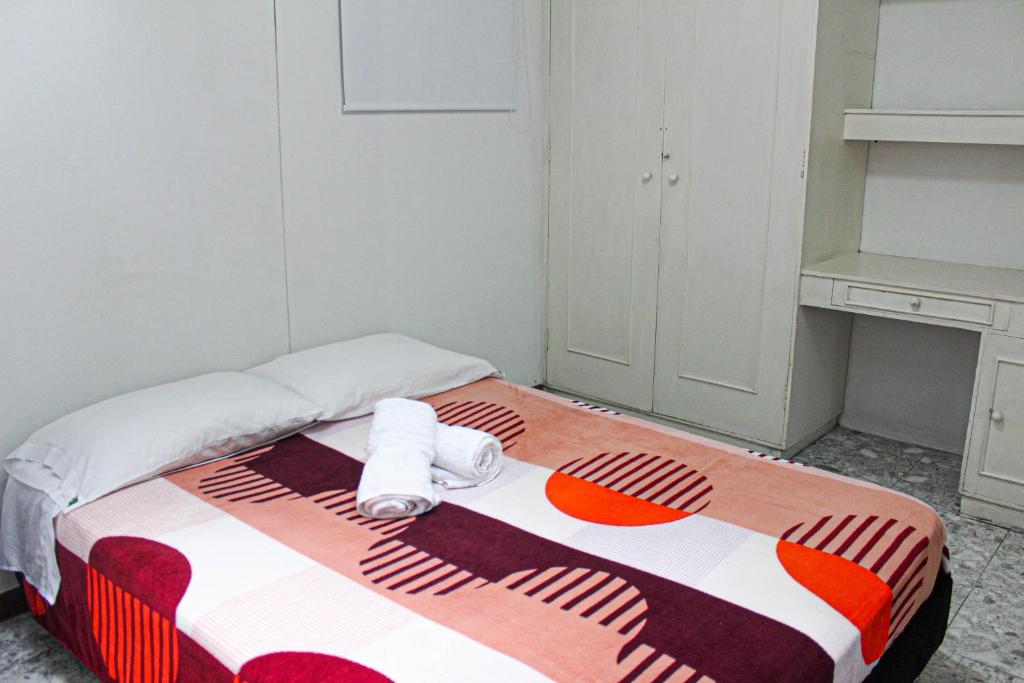 Postel nebo postele na pokoji v ubytování El Cable Hostal