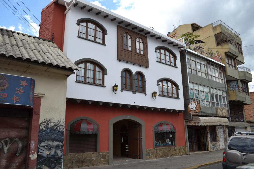 a building on a street in a city at Hostel Running Chaski in Cochabamba