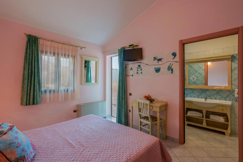 Postel nebo postele na pokoji v ubytování Hotel Solanas