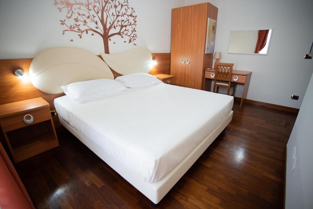 Postel nebo postele na pokoji v ubytování BB Domus Catanzaro