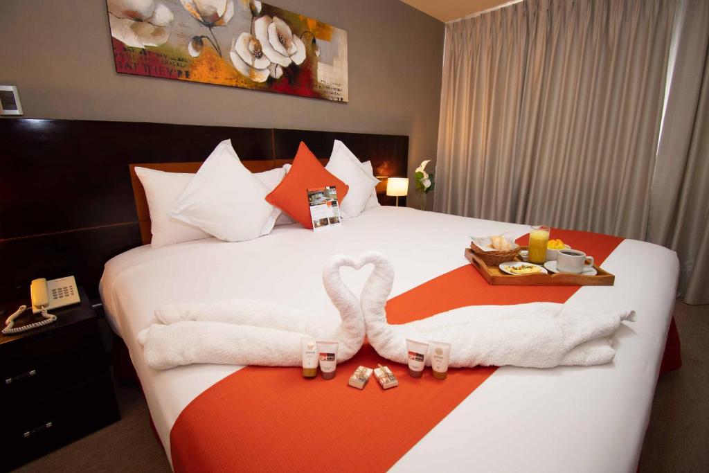 Letto o letti in una camera di SM Hotel