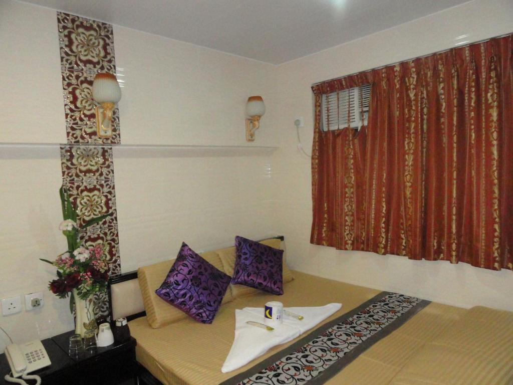 Postel nebo postele na pokoji v ubytování Dhillon Hotel -Guest House & Hostel