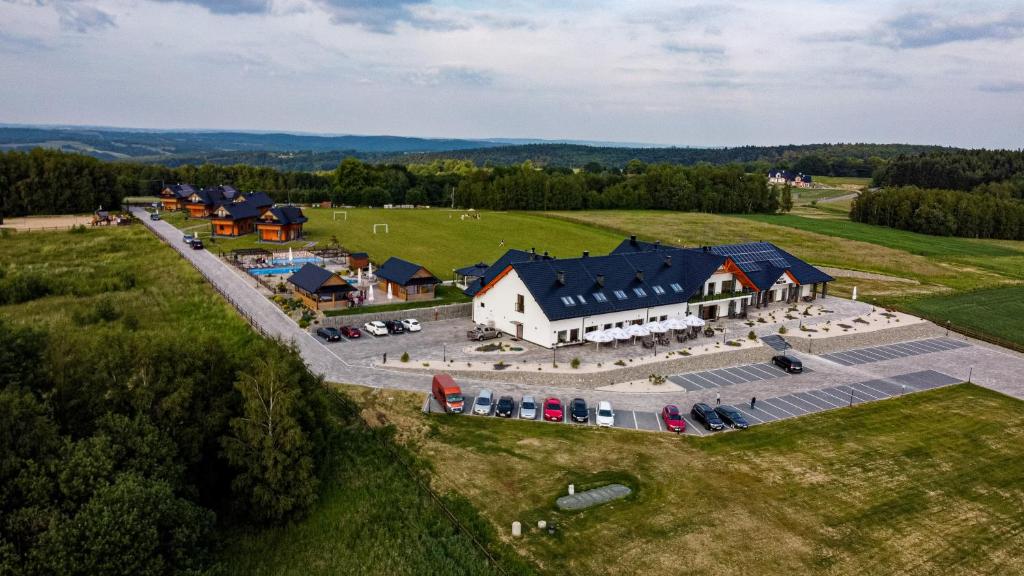 an aerial view of a farm with a building at Stara Warzelnia in Baryczka