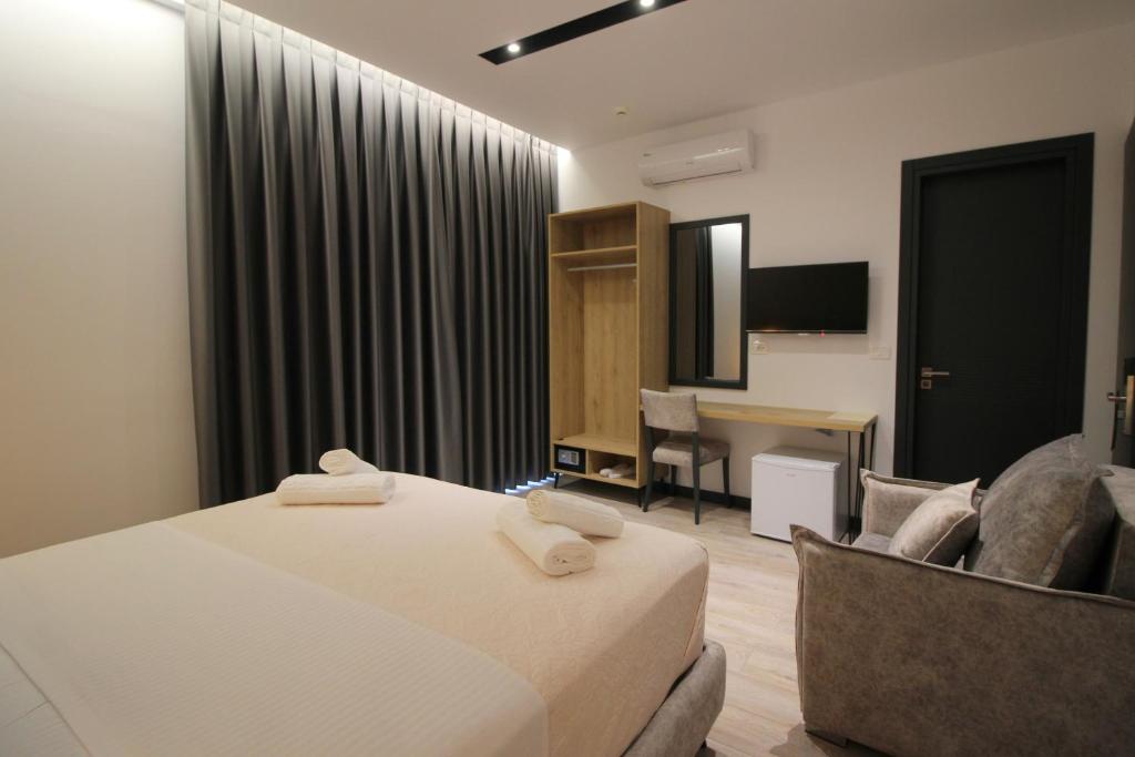 Postel nebo postele na pokoji v ubytování F&J Hotel