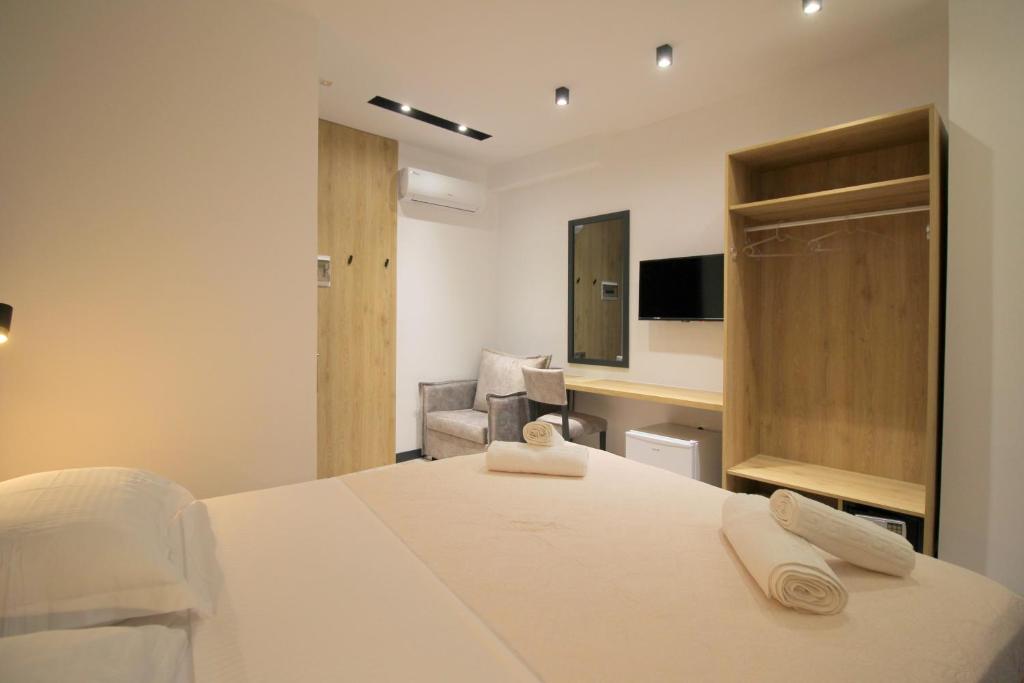 Postel nebo postele na pokoji v ubytování F&J Hotel
