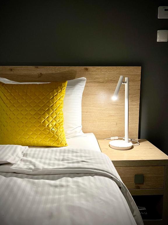 Posteľ alebo postele v izbe v ubytovaní Rezydencja Pod Ochorowiczówką B&B