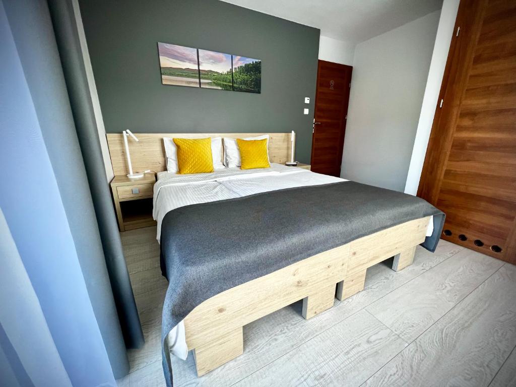 Posteľ alebo postele v izbe v ubytovaní Rezydencja Pod Ochorowiczówką B&B