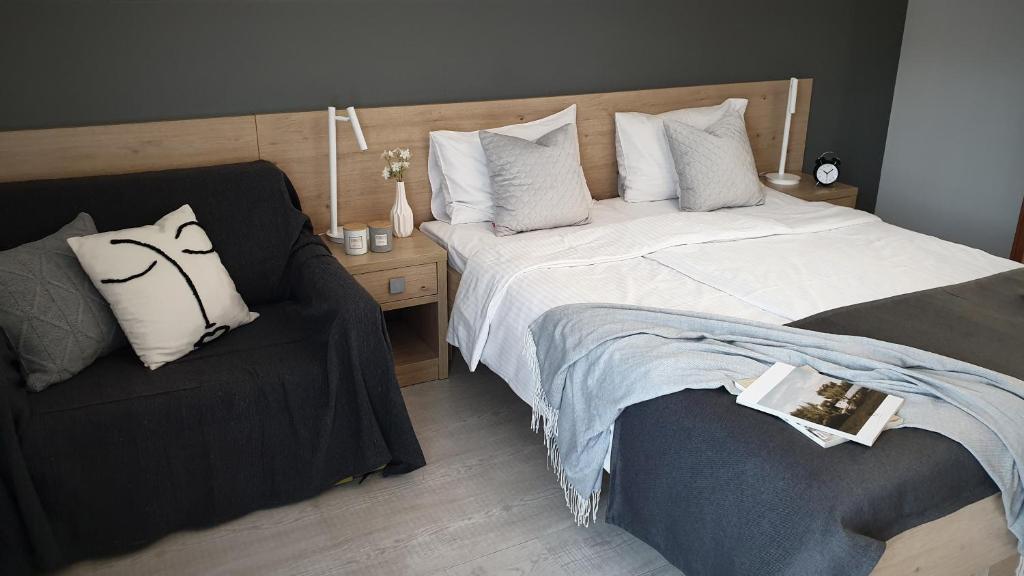 Posteľ alebo postele v izbe v ubytovaní Rezydencja Pod Ochorowiczówką B&B