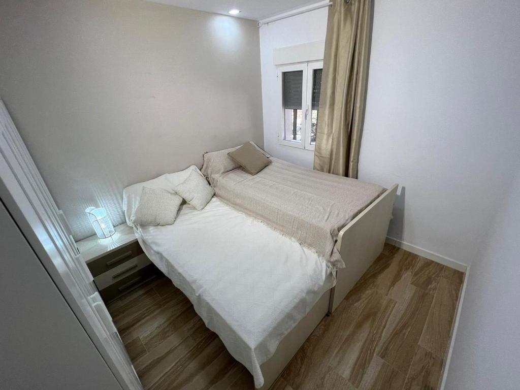 Posteľ alebo postele v izbe v ubytovaní Camaretas sweet dreams acogedor piso junto al mar