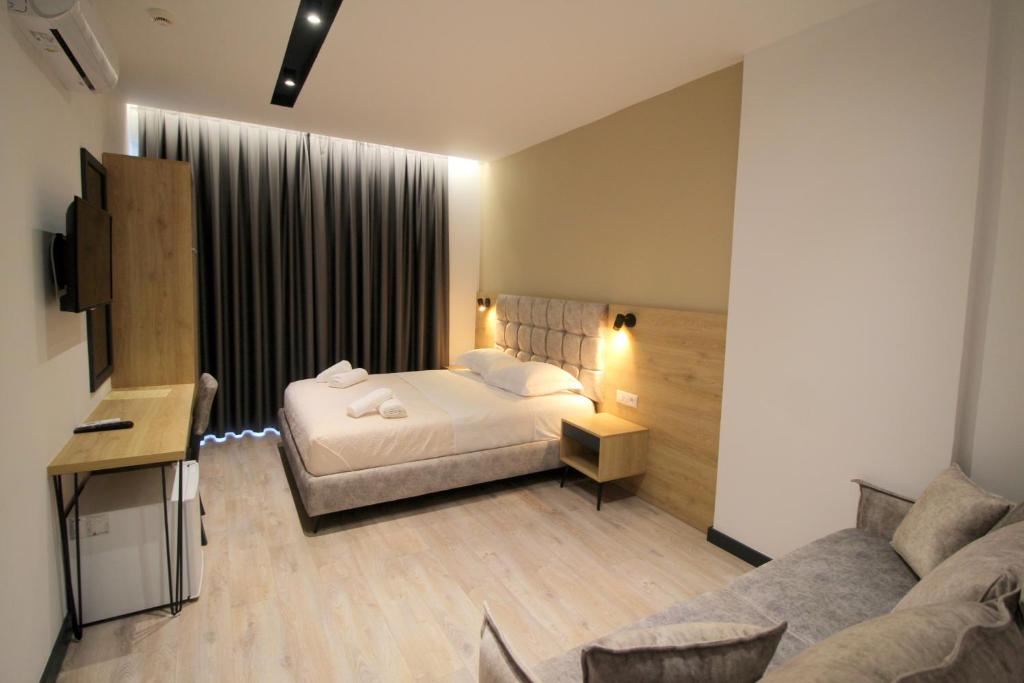 Postel nebo postele na pokoji v ubytování F&J Hotel
