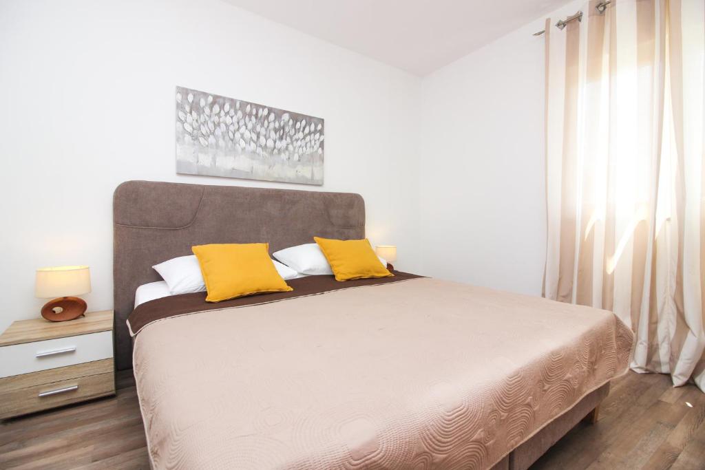 Posteľ alebo postele v izbe v ubytovaní Apartments Lotta