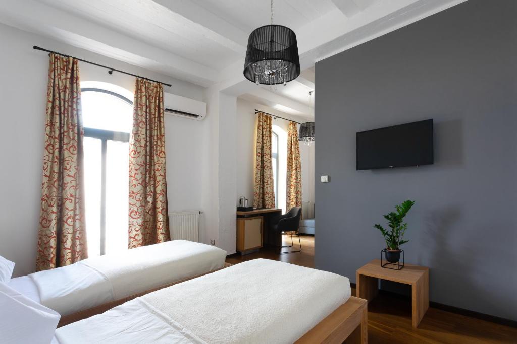 Posteľ alebo postele v izbe v ubytovaní Arena Hotel Samorin