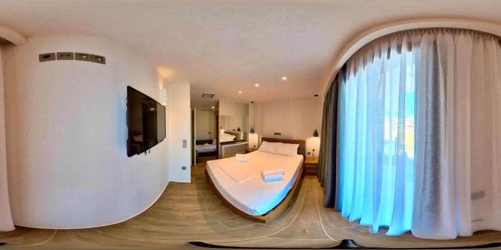Posteľ alebo postele v izbe v ubytovaní Mulberry Nikiti Resorts