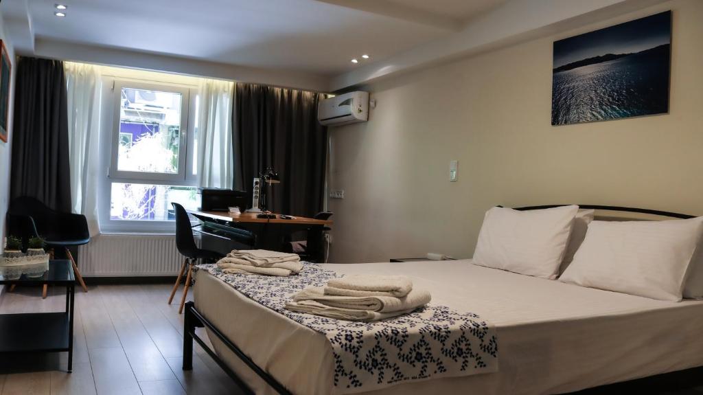 A bed or beds in a room at Studio City Center