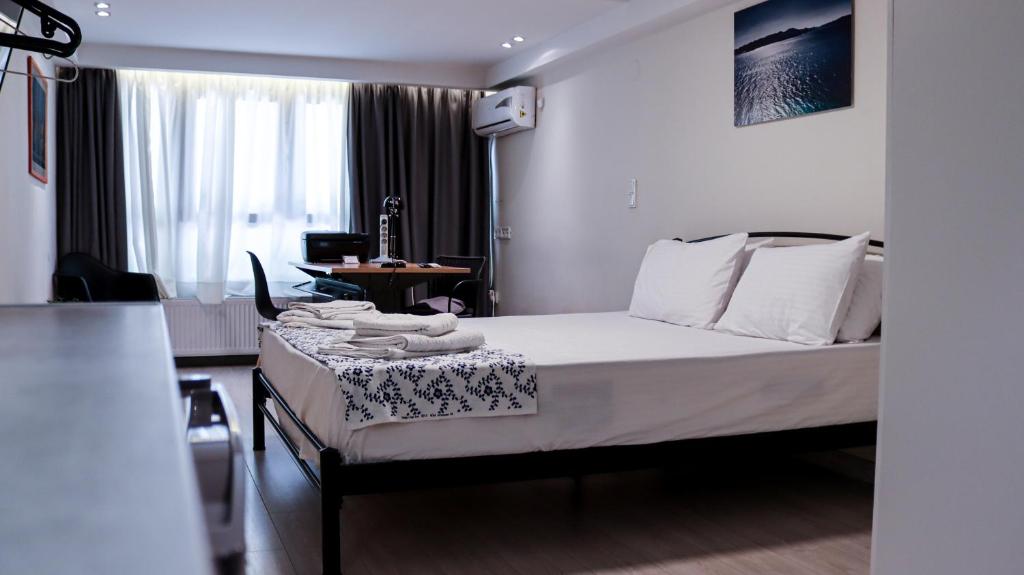 A bed or beds in a room at Studio City Center
