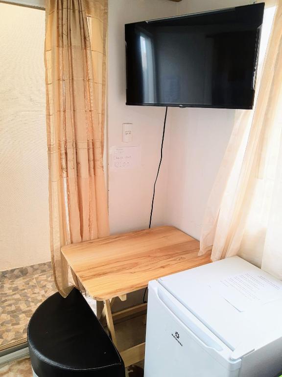 TV a/nebo společenská místnost v ubytování Dulcinea Mini House