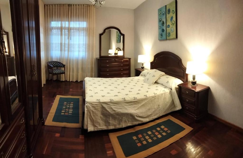 Postel nebo postele na pokoji v ubytování Vivienda familiar en la Ría de Vigo