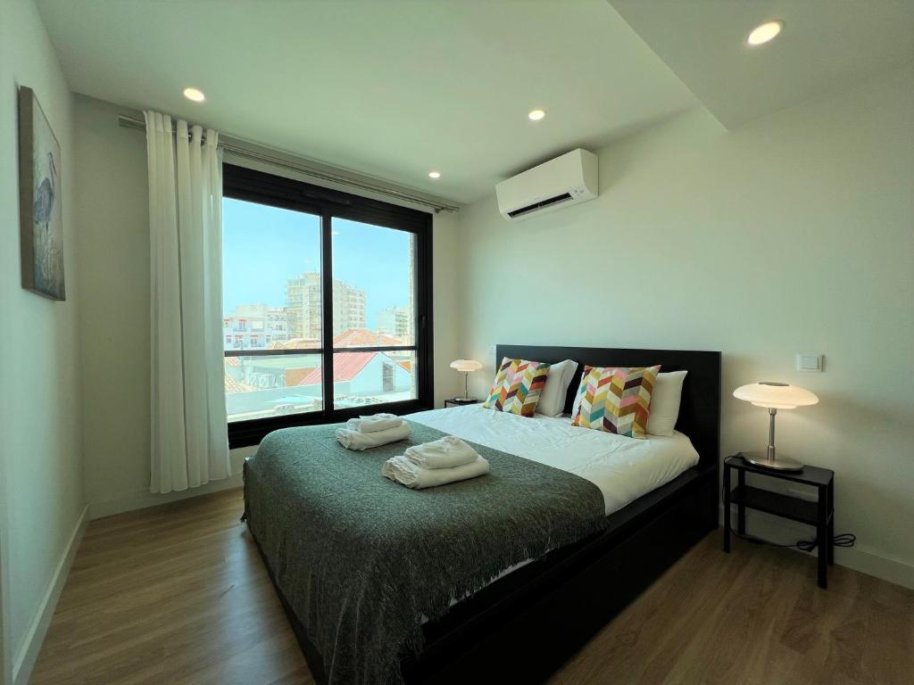 מיטה או מיטות בחדר ב-Faro Design 3 by Homing
