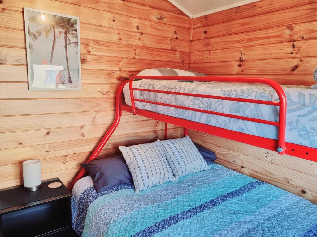 Postel nebo postele na pokoji v ubytování Opononi Bliss