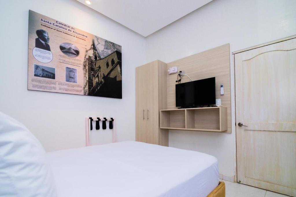 Katil atau katil-katil dalam bilik di Hotel Gallery Cartagena
