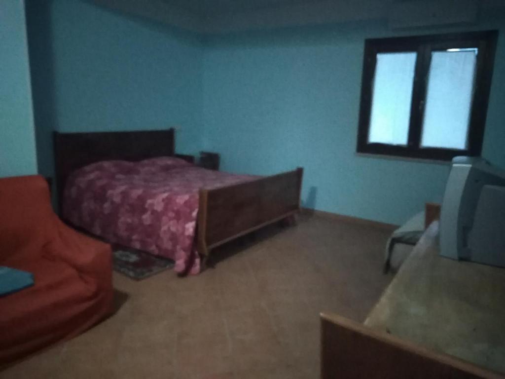 Łóżko lub łóżka w pokoju w obiekcie AZIENDA AGRITURISTICA LA VECCHIA QUERCIA