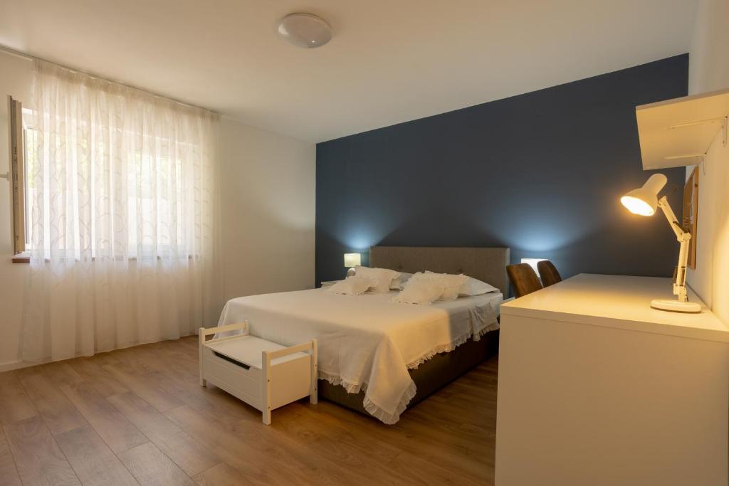 Posteľ alebo postele v izbe v ubytovaní Apartman Citromelo