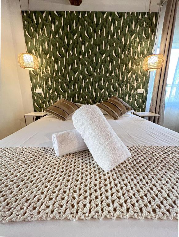 Postel nebo postele na pokoji v ubytování NEW! -Verderame Rooms & Suite in Lucca