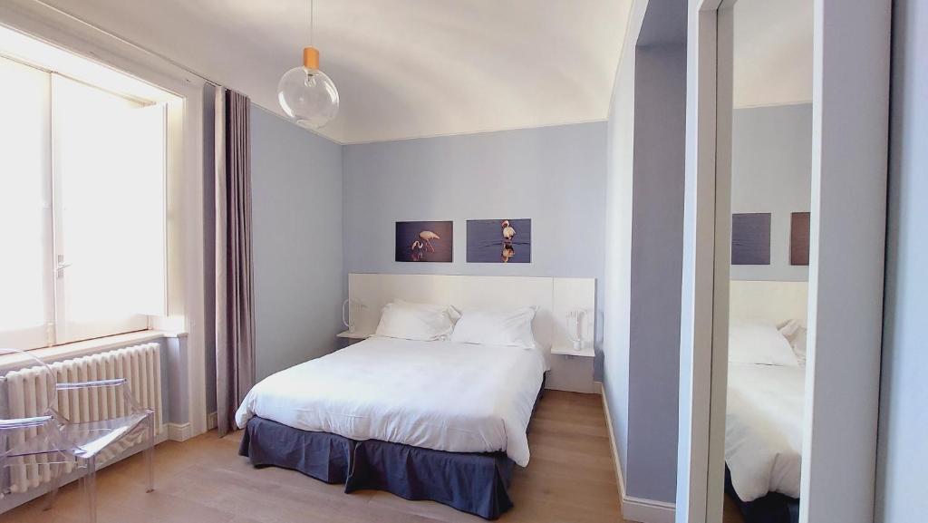 Postel nebo postele na pokoji v ubytování D-Home Ortigia