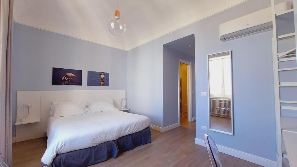 Postel nebo postele na pokoji v ubytování D-Home Ortigia