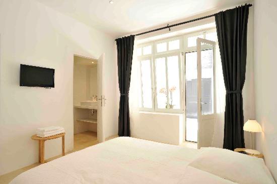 Postel nebo postele na pokoji v ubytování Maison Boussingault