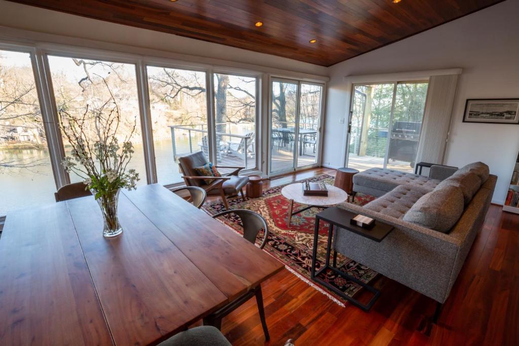 a living room with a table and a couch at Chase Creek Retreat in Annapolis