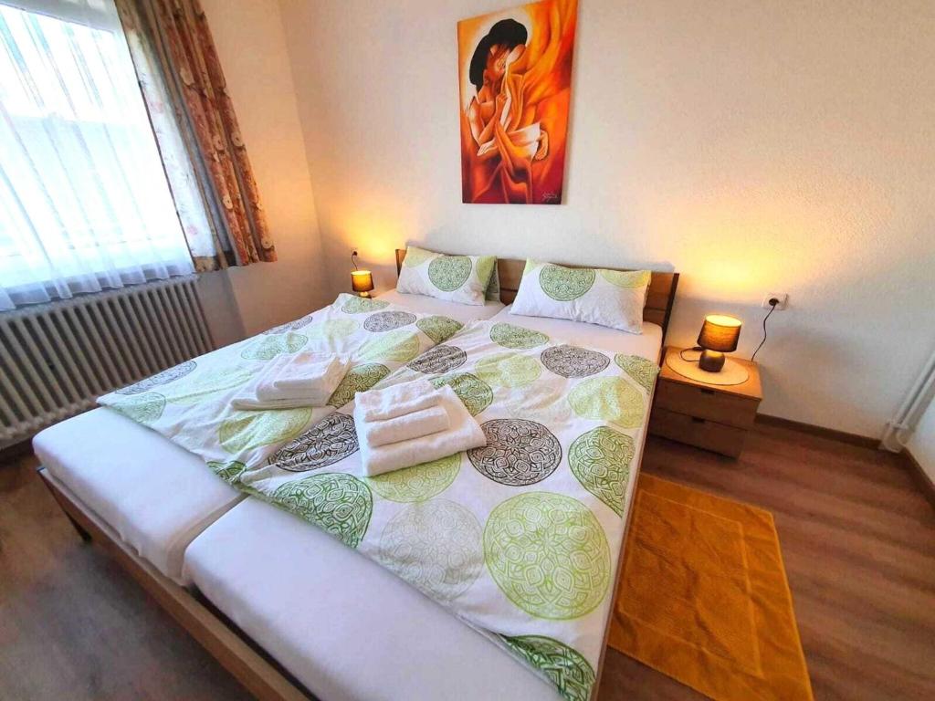 Postel nebo postele na pokoji v ubytování Apartment in Görwihl near Black Forest Waterfalls