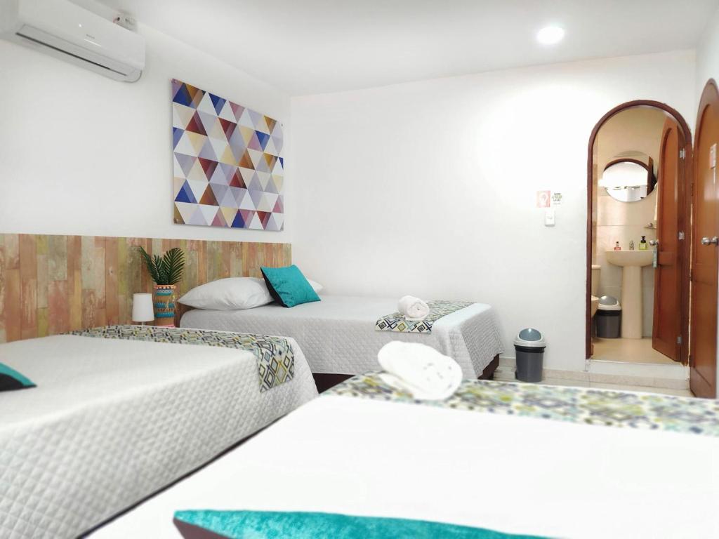 Postel nebo postele na pokoji v ubytování Walena Hotel
