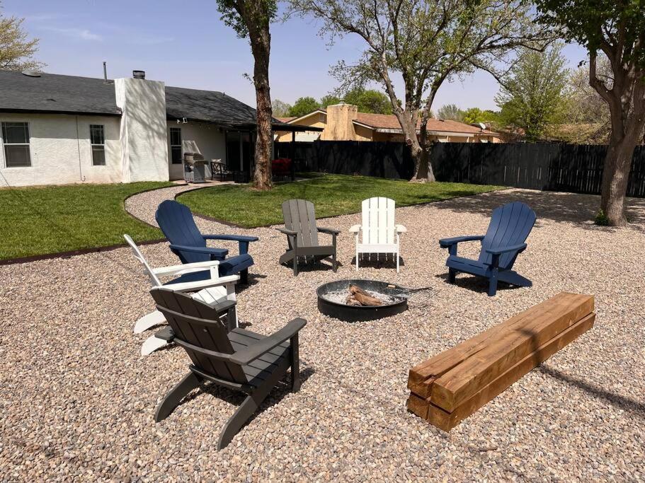 a group of chairs and a fire pit in a yard at Sunrise Experience w/King Size Bed & Pet Friendly in Roswell