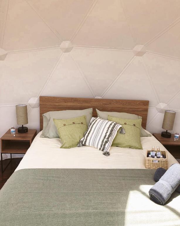 Postel nebo postele na pokoji v ubytování MAUNA Glamping