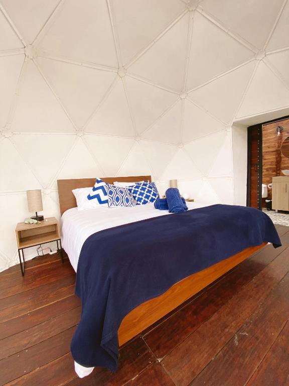 Postel nebo postele na pokoji v ubytování MAUNA Glamping