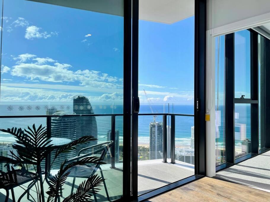 a balcony with a view of the ocean from a building at Luxury Oceanview 2beds serviced apt 47F in Gold Coast