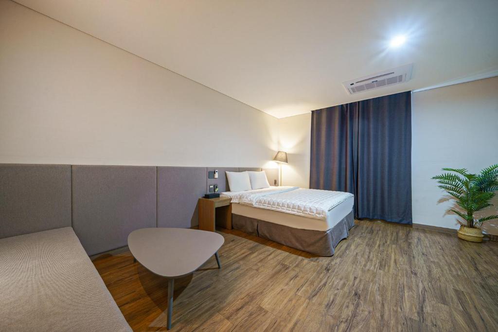 Postel nebo postele na pokoji v ubytování MTM Family Hotel