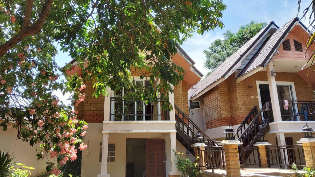 a house with a staircase in front of it at Wilai Villa Lamai in Lamai