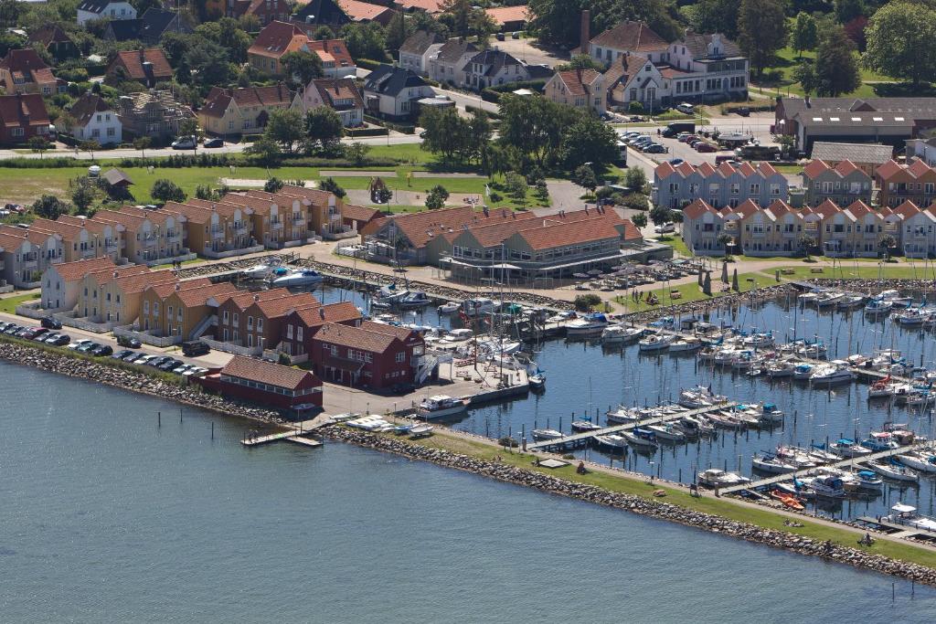 an aerial view of a marina with boats and buildings at Hotel Rudkøbing Skudehavn Apartments in Rudkøbing