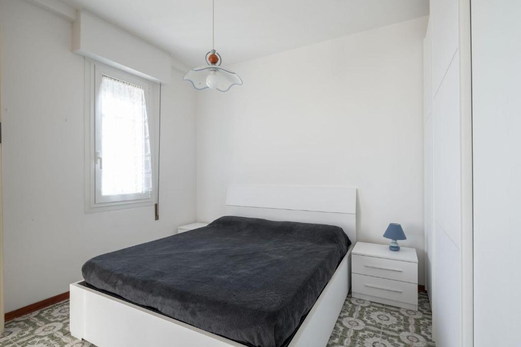 A bed or beds in a room at Playa Grande 504 - Immobiliare Living