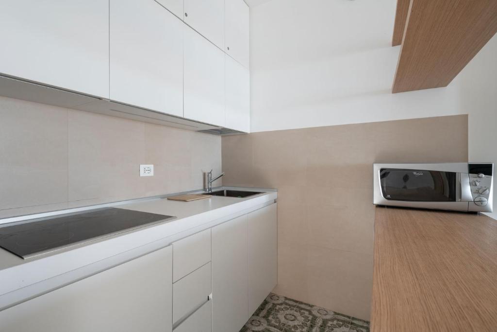 A kitchen or kitchenette at Playa Grande 504 - Immobiliare Living
