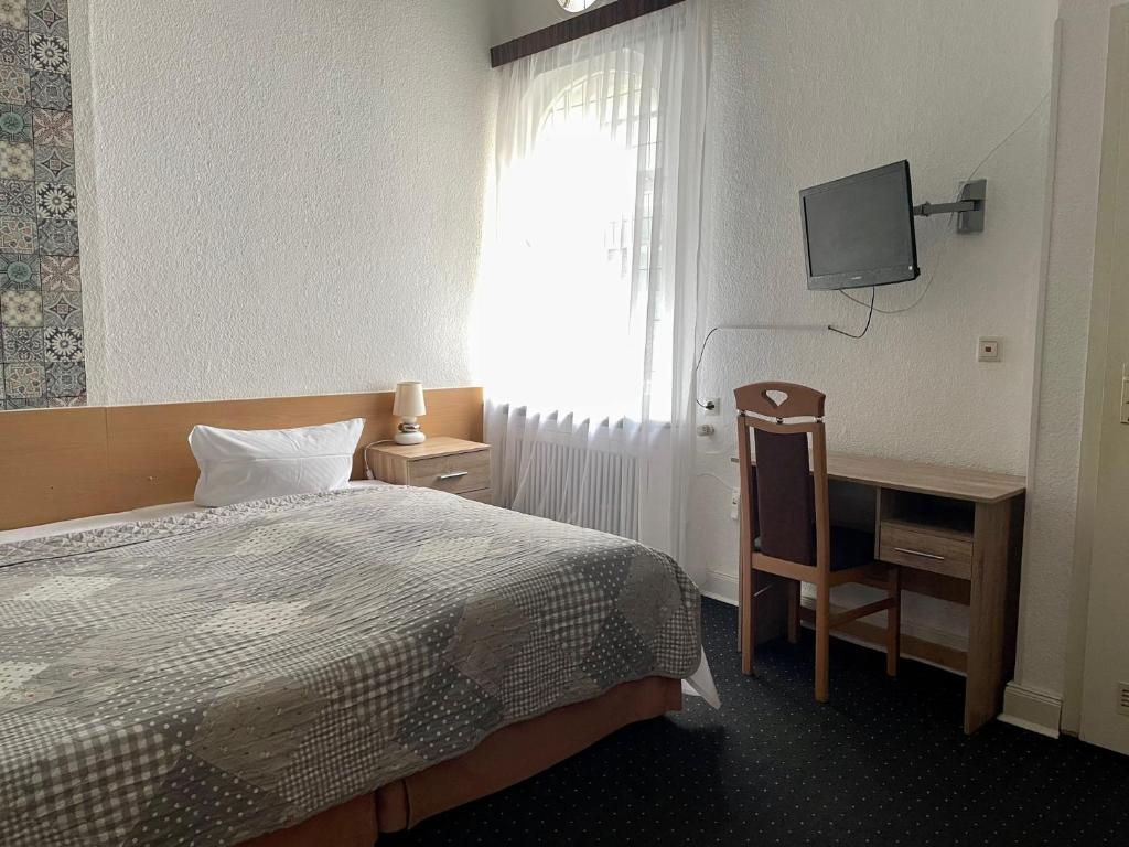 Postel nebo postele na pokoji v ubytování Hotel Castell am Kurfürstendamm
