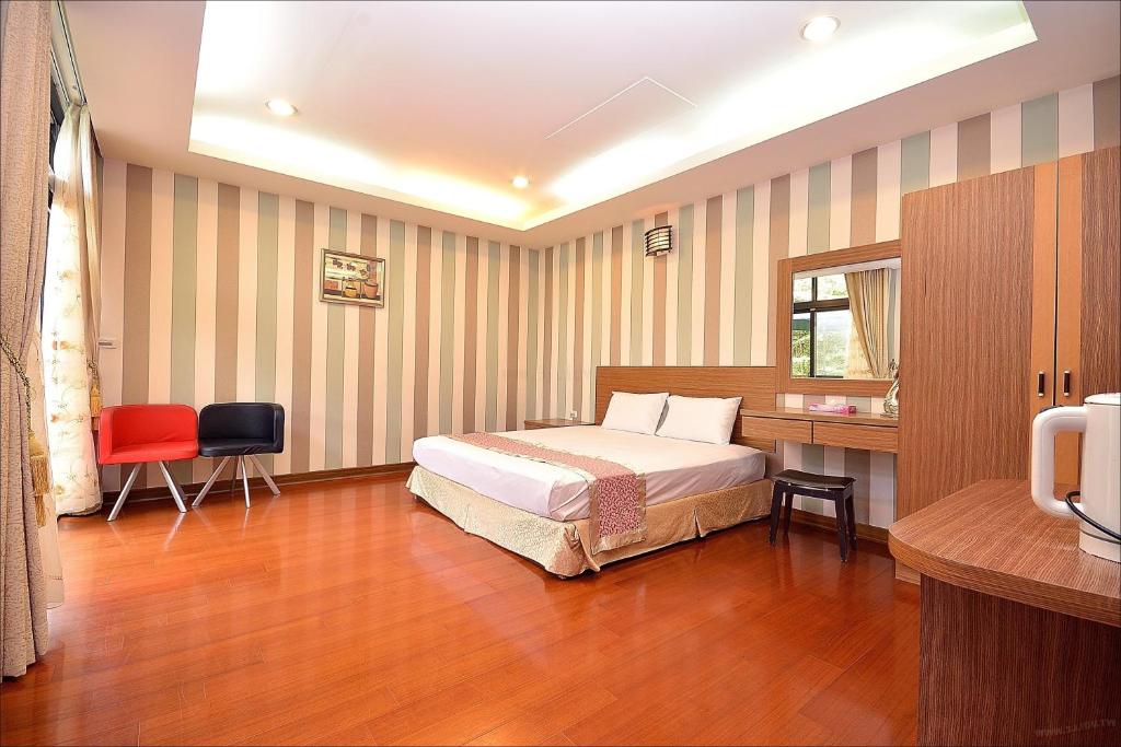 Postel nebo postele na pokoji v ubytování Sitou Peach Villa B&B