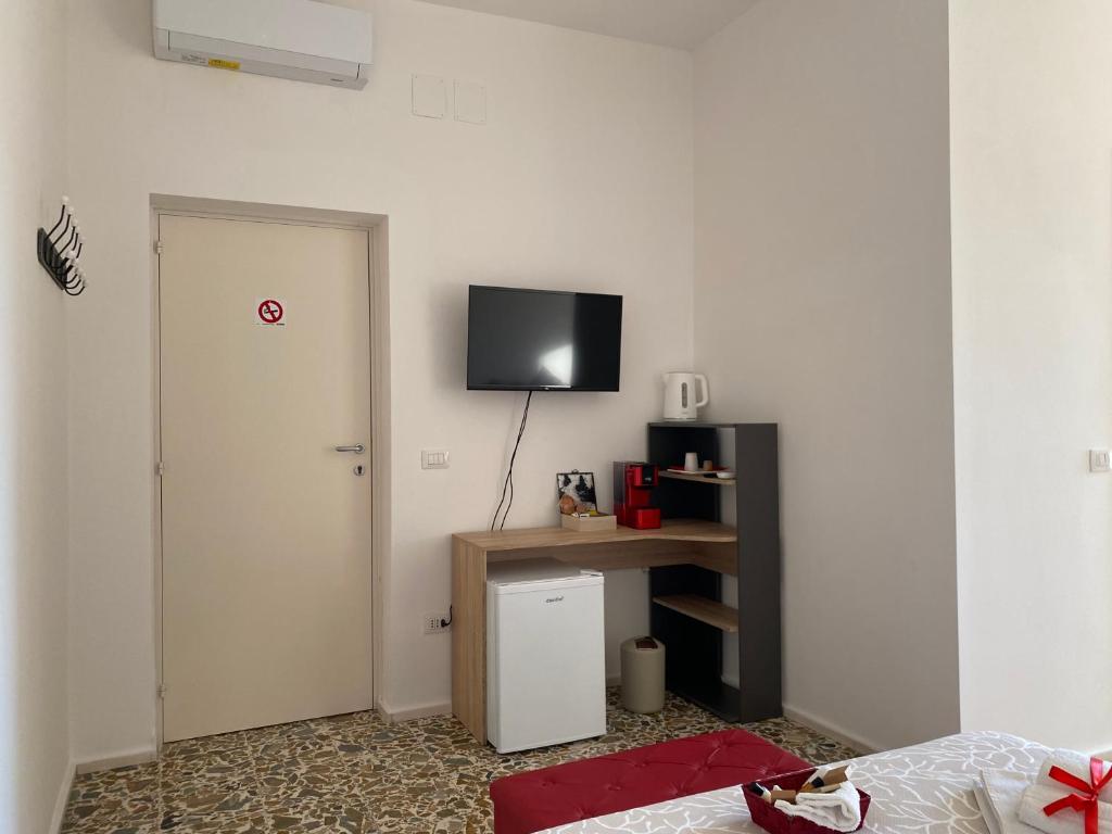 TV a/nebo společenská místnost v ubytování Rossocorallo Rooms