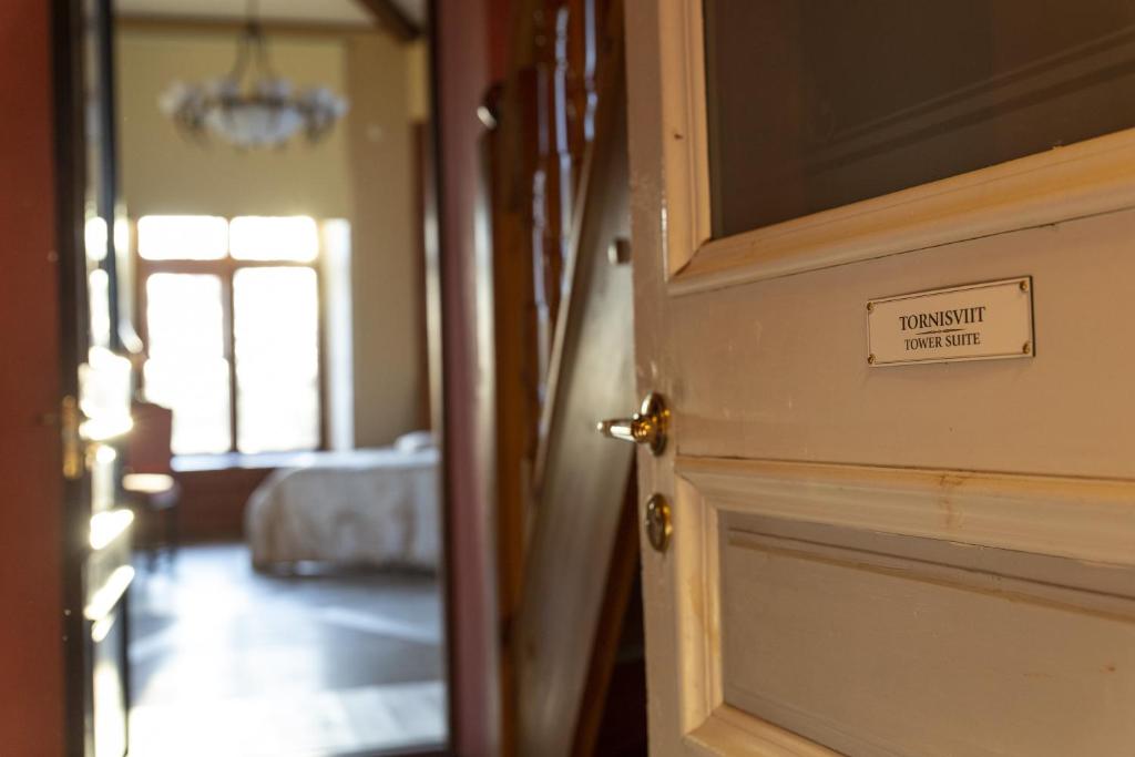 Postel nebo postele na pokoji v ubytování Laitse castle