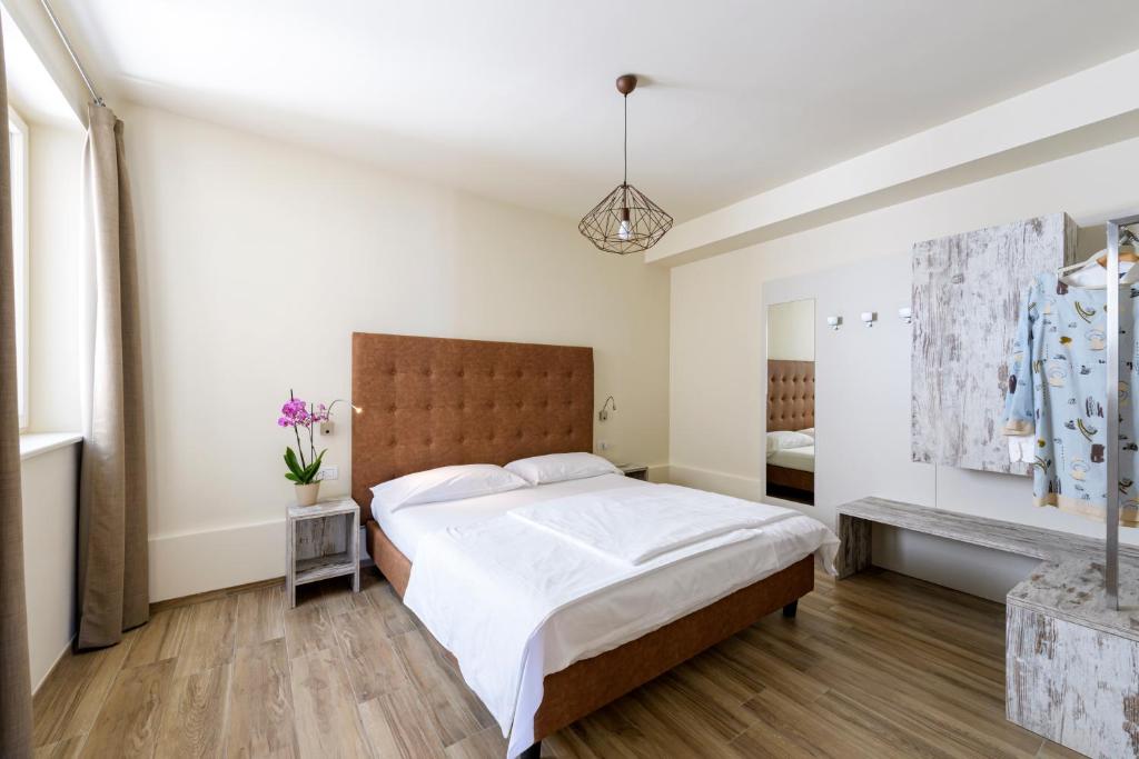 Postel nebo postele na pokoji v ubytování Residence Ruculì - Ruculì Hospitality