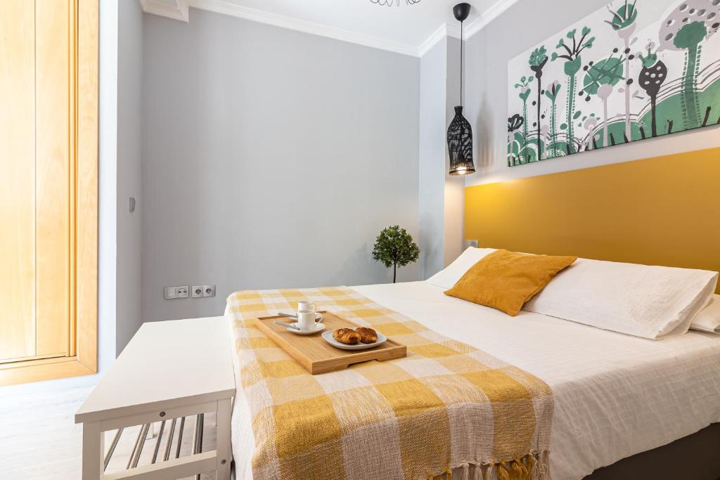 Łóżko lub łóżka w pokoju w obiekcie Malaga Center Flat - SoHo Center Apartments
